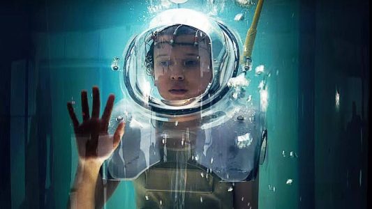 Eleven from Stranger Things being trained in a sensory deprivation tank